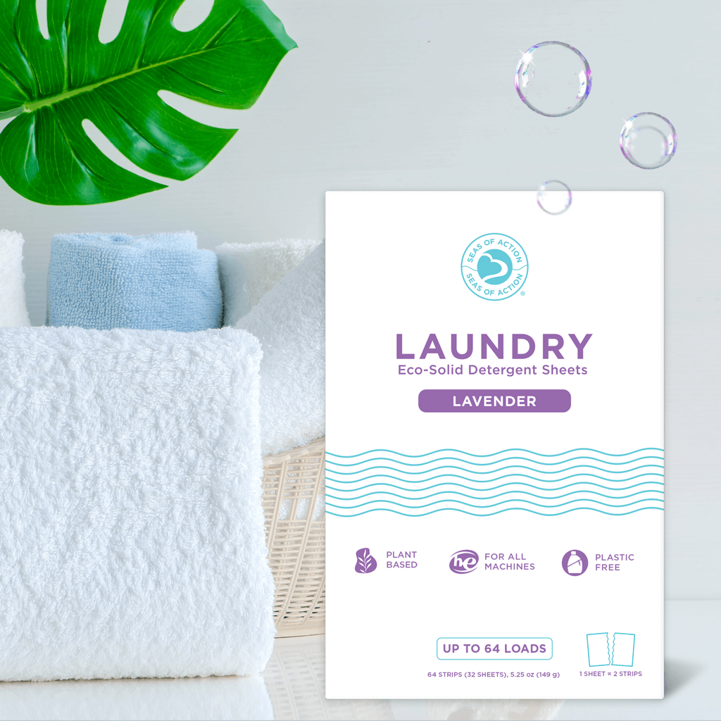 Pack of Seas of Action laundry detergent sheets in lavender scent with folded towels and green leaf in the background