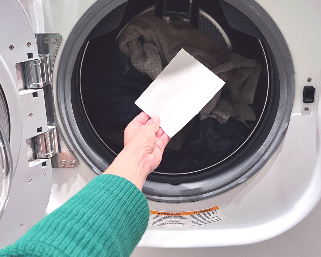 Putting one laundry detergent sheet in a high efficiency washing machine